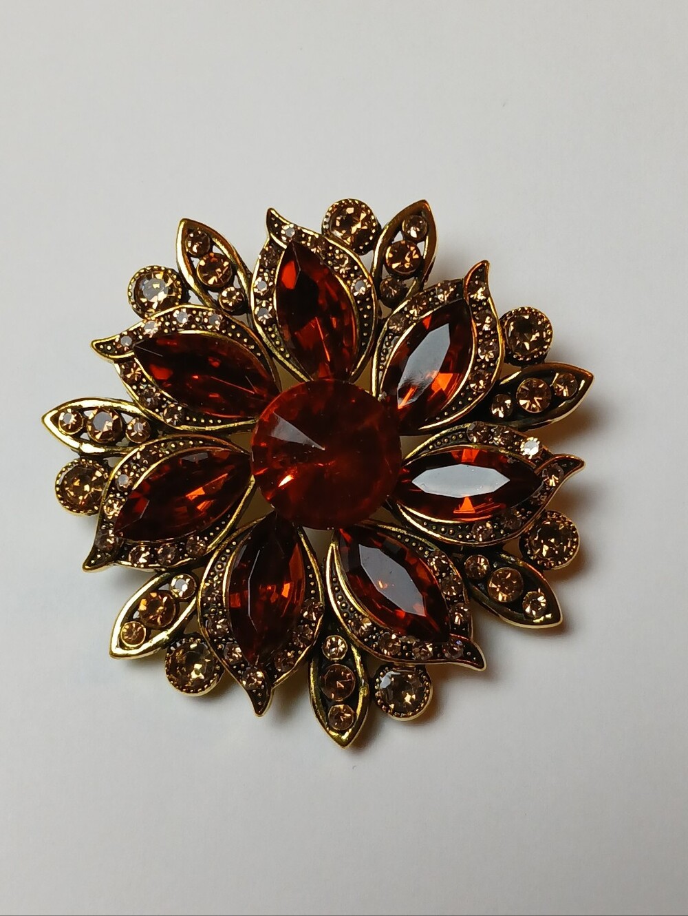 Hand Crafted Gold Floral Brooch with Deep Amber Red Crystals